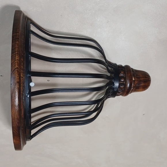 Beautiful accent shelf black worght iron basket dark wood shelf and bottom